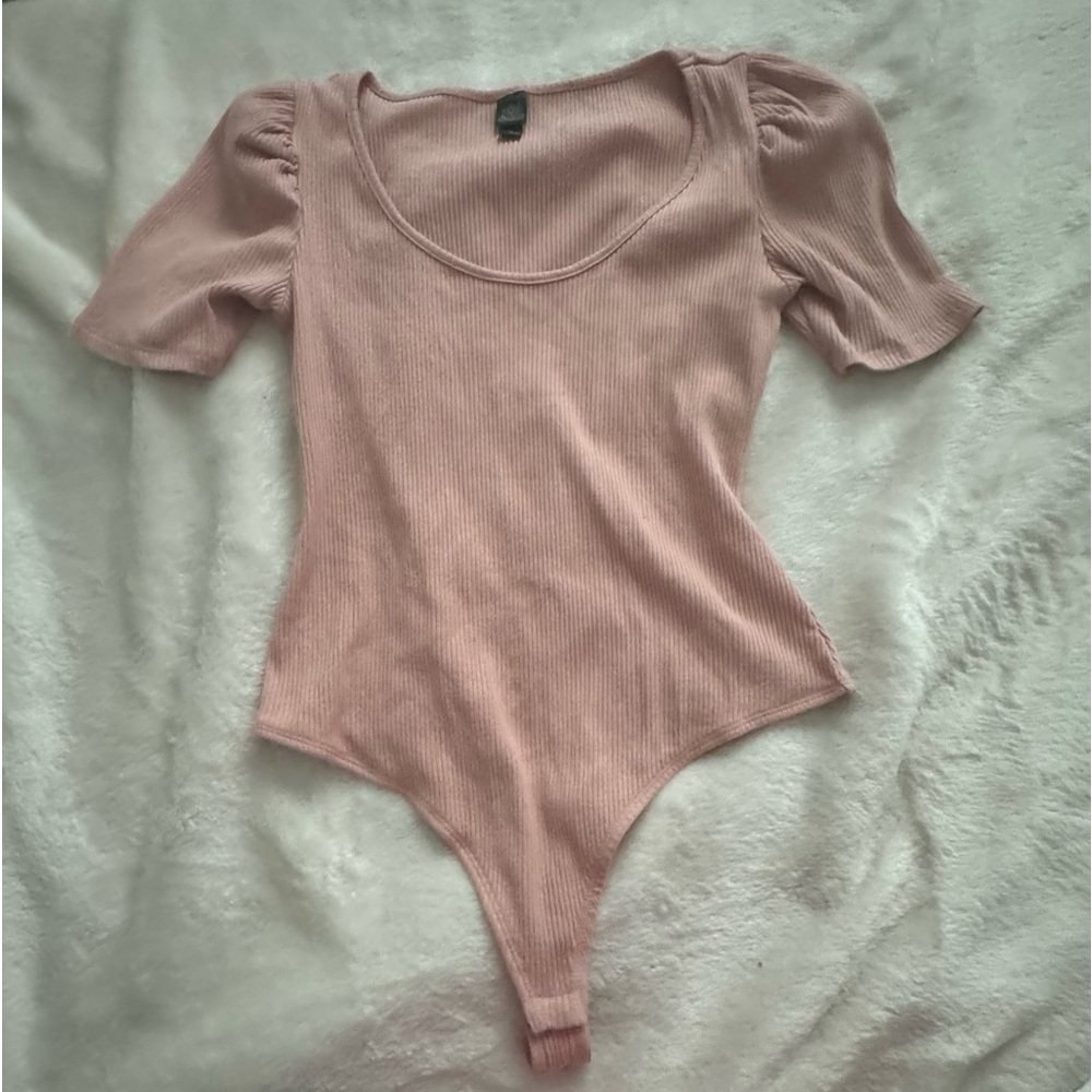 pink body suit with puff sleeves